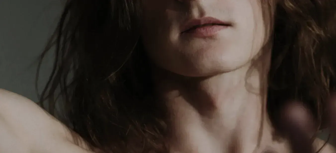 A close up of a man with long hair