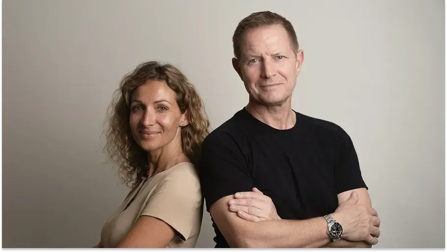 Two professionals posing together