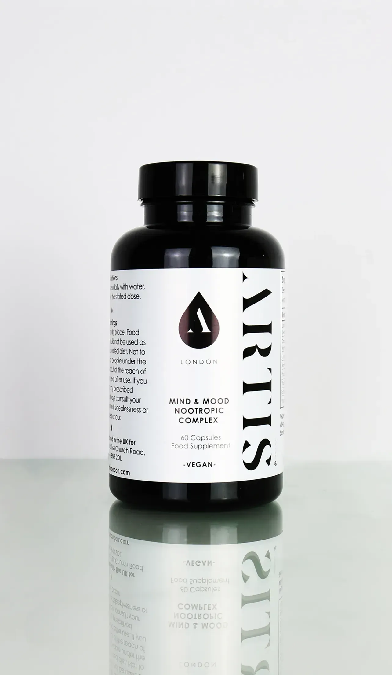 A bottle of vitamins sitting on top of a table
