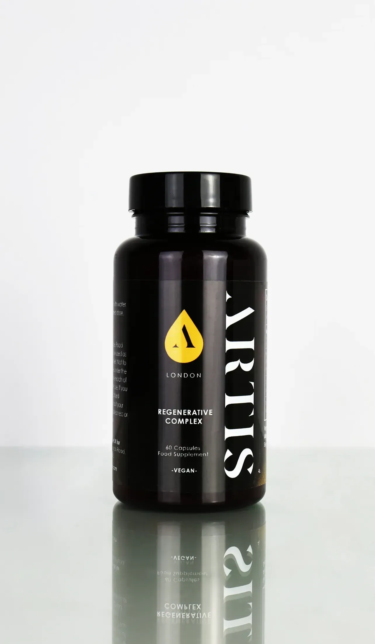 A bottle of vitamin supplement sitting on a table